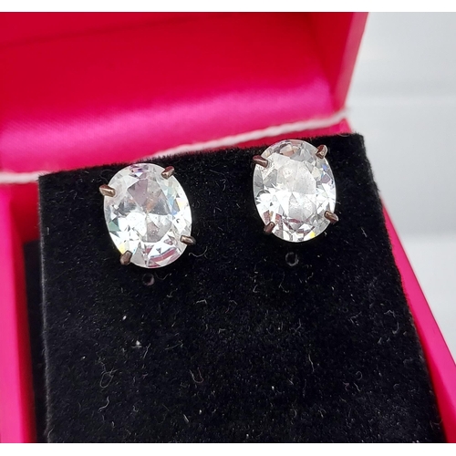 515 - A pair of substantial silver CZ stud earrings [10.0mm in length]