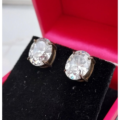 515 - A pair of substantial silver CZ stud earrings [10.0mm in length]