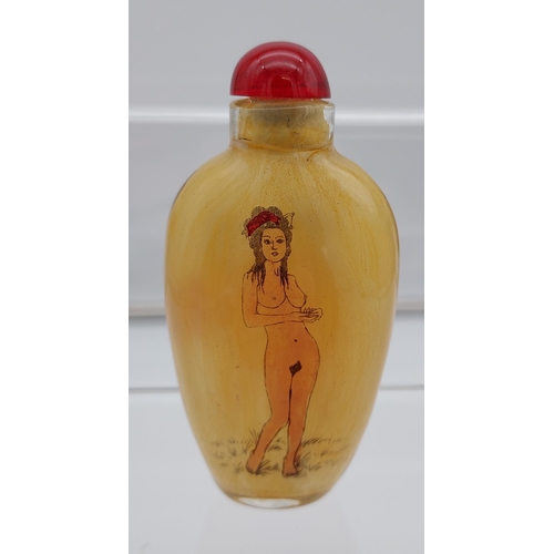 537 - A Chinese hand painted glass perfume bottle showing two nude figures to each side.