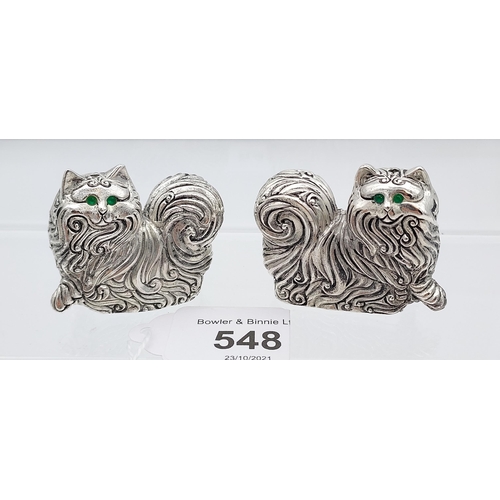 548 - A pair of silver plated long haired cat condiments with emerald eyes