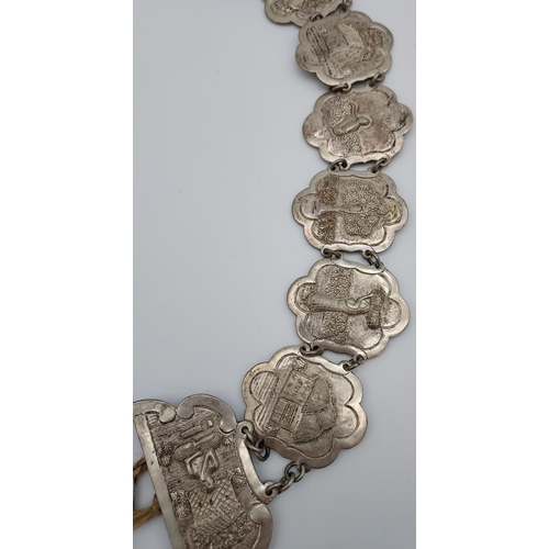 559 - An Indian ornate silver belt. [206.90grams]