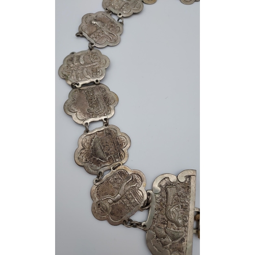 559 - An Indian ornate silver belt. [206.90grams]