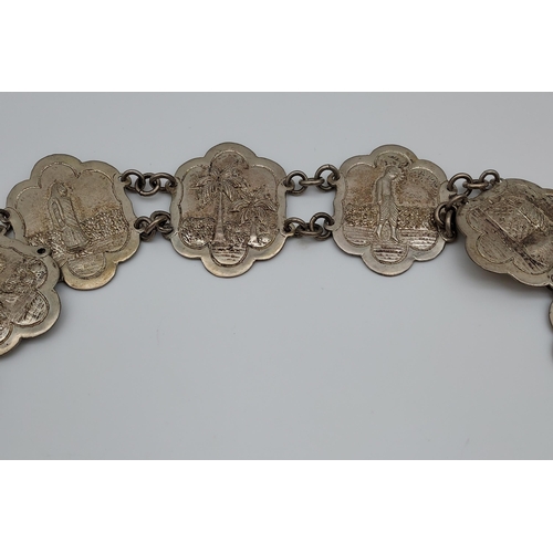 559 - An Indian ornate silver belt. [206.90grams]