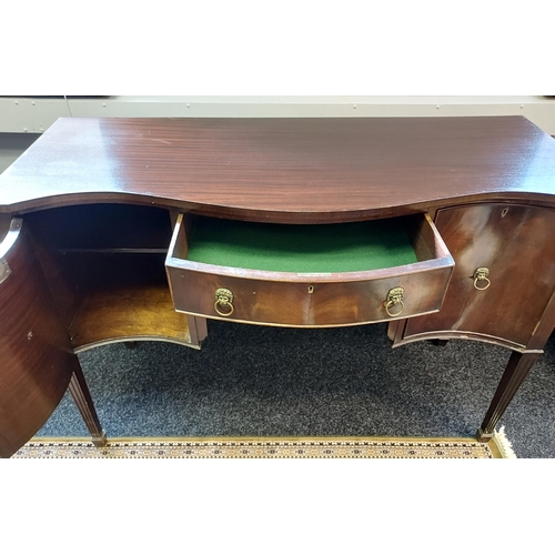 85 - A 19th century serpentine front sideboard. supported on square tapered legs. Brass lion head handles... 