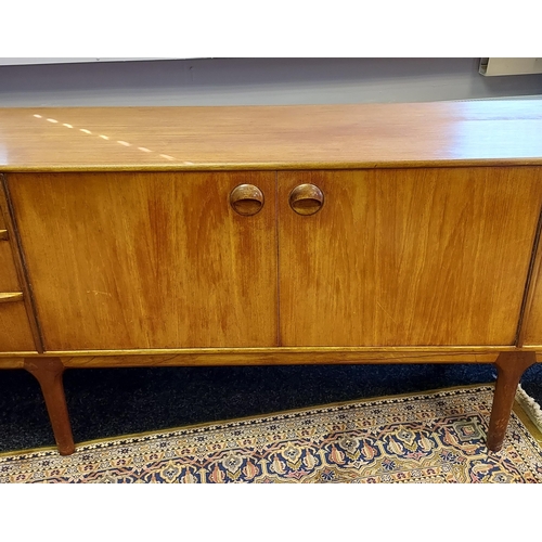 89 - A Mid century Teak pedestal sideboard produced by A.H. McIntosh & co Ltd. [76x213x45cm]