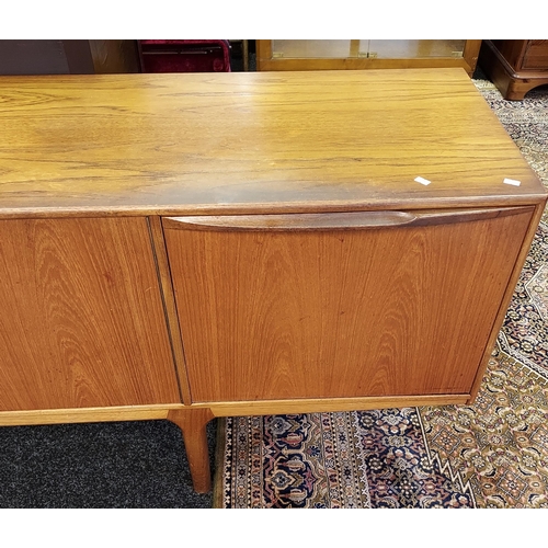 90 - A Mid century Teak pedestal sideboard produced by A.H. McIntosh & co Ltd. [76x213x45cm]