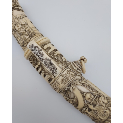 390 - A 19th/ early 20th century highly decorative Japanese Tanto. Carved from ivory. Saya has a smaller b... 