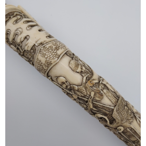 390 - A 19th/ early 20th century highly decorative Japanese Tanto. Carved from ivory. Saya has a smaller b... 