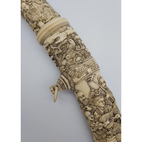 390 - A 19th/ early 20th century highly decorative Japanese Tanto. Carved from ivory. Saya has a smaller b... 