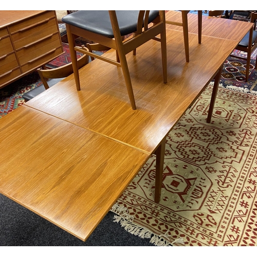 330 - A Danish teak mid century extendable dining table together with 8 matching stylish teak chairs by Ve... 