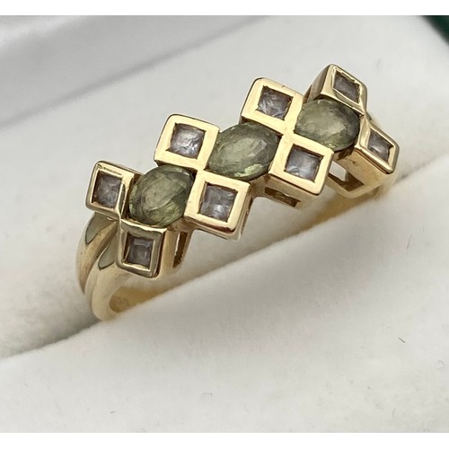 10 - A Ladies 9ct yellow gold ring set with clear stones. [Ring size O] [2.73Grams]