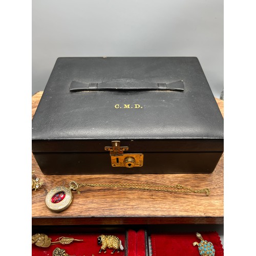 29 - A Vintage jewel box containing a quantity of costume jewellery brooches, necklaces and bracelet etc