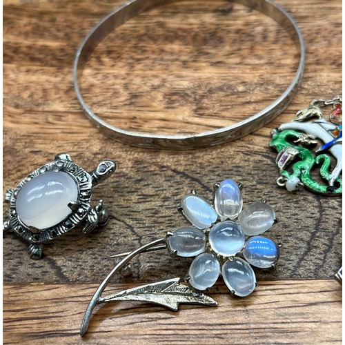 28 - A Selection of vintage silver jewellery to include moonstone style flower design brooch, Turtle broo... 