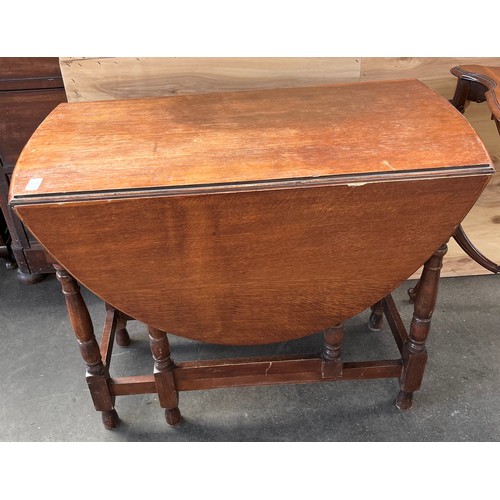 233 - Antique drop end kitchen table. Together with an ornate two tier window table in need of attention. ... 