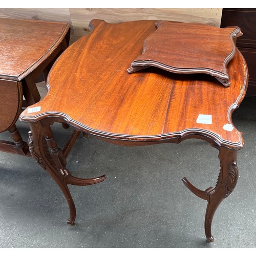 233 - Antique drop end kitchen table. Together with an ornate two tier window table in need of attention. ... 