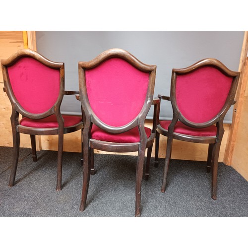 252 - Three 19th century chair's, the cushioned shield back with nail head trim leading to open arm suppor... 