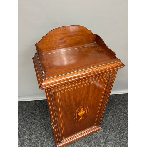 279 - A 19th century Mahogany and boxwood strung music cabinet. The door with inlaid urn motif. [113x55x32... 