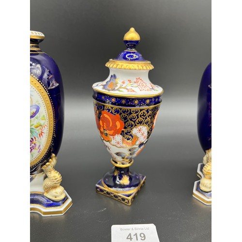 419 - A Late 19th/ early 20th century Royal Crown Derby hand painted lidded urn with lid, Together with a ... 