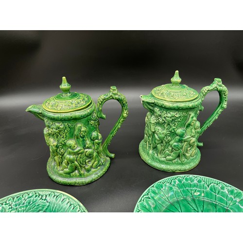 416 - A pair of antique Dunmore pottery coffee pots with raised relief cherub design. Together with Green ... 