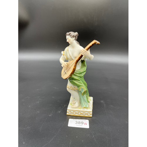 389 - A 19th century Meissen lady figurine playing a mandolin. [16cm high]