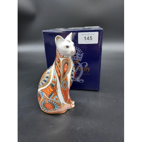 145 - A Royal Crown Derby Siamese cat paperweight, gold button and comes with original box.