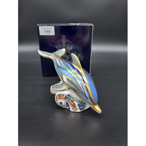 146 - A Royal Crown Derby Stripe Dolphin paperweight, gold button and comes with original box.