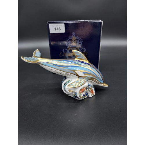 146 - A Royal Crown Derby Stripe Dolphin paperweight, gold button and comes with original box.