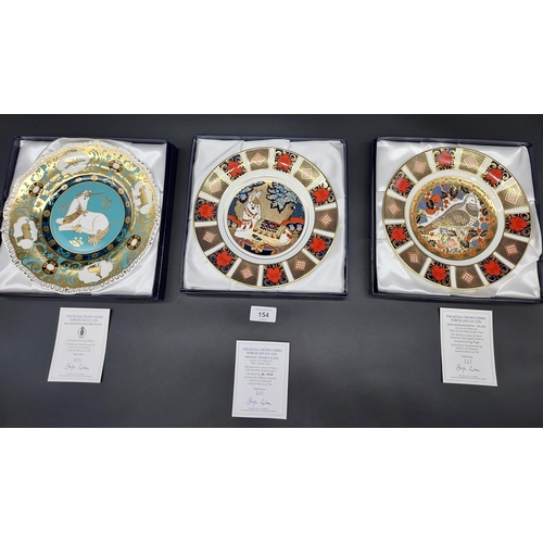 154A - Three Limited Edition Royal Crown Derby collectors plates titled 'Millennium Dove, Unicorn and Thist... 