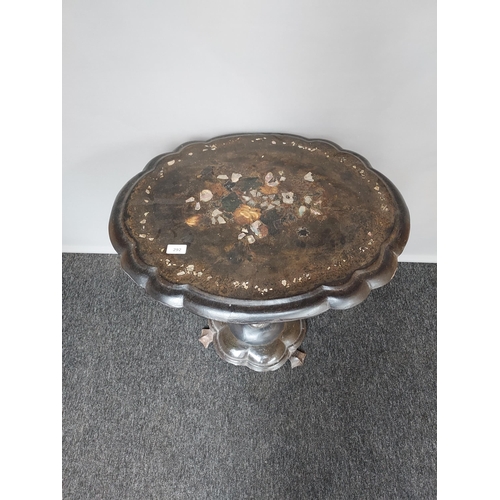 292 - Antique lacquered/ papermache pedestal table, detailed with mother of pearl inlays. [70x66x54cm]