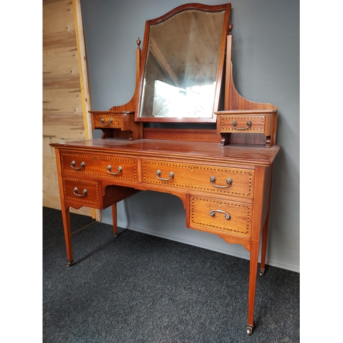 293 - A 19th century knee hole dressing table chest. Fitted with a swivel mirror top and small drawers. Su... 