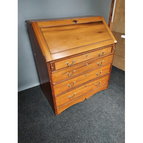 308 - A Lightwood four drawer writing bureau, Interior is fitted with pigeon holes and small drawers. [109... 