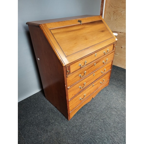 308 - A Lightwood four drawer writing bureau, Interior is fitted with pigeon holes and small drawers. [109... 