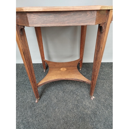 310 - Antique Octagonal two tier window table, designed with a central inlaid motif. Finished on square ta... 