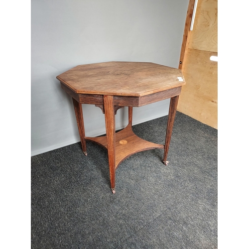 310 - Antique Octagonal two tier window table, designed with a central inlaid motif. Finished on square ta... 