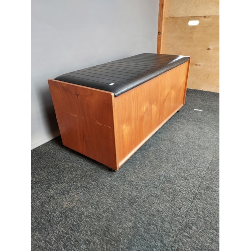 327 - A Mid century teak and faux leather ottoman [48x100x42cm]