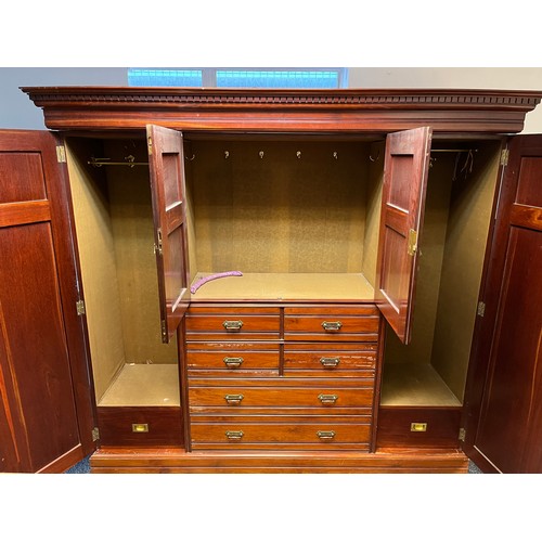 253 - A Victorian Mahogany Compactum Wardrobe late 19th century, The dentil moulded cornice above a centra... 