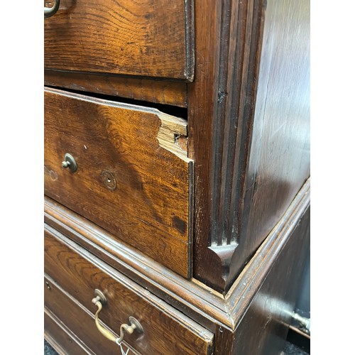 255 - A Georgian III Oak chest on chest late 18th century. The key moulded cornice above three short and t... 