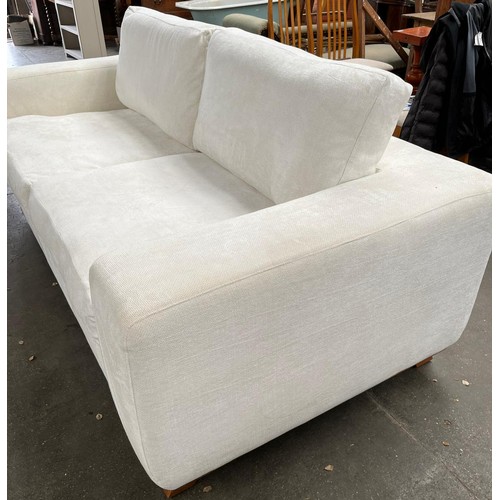 519 - Large Linely designer Sofa with feather filled cushions in white material. Some area's do have marks... 