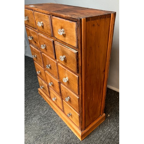 267 - Stripped pine apothecary unit, an arrangement of 15 drawers raised on a plinth base [70x55x20cm]