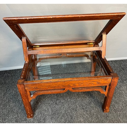 263 - 19th century oak glass table, the lift-up top held up by a bracket with a glass shelf base above a s... 