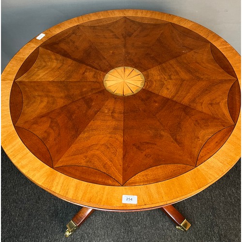 254 - Antique style mahogany table, the circular surface with banding and inlaid shell design, raised on a... 