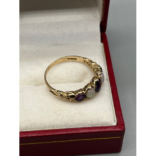 22 - Ladies antique 9ct yellow gold ring set with three amethyst and two opal stones. Stone set within an... 