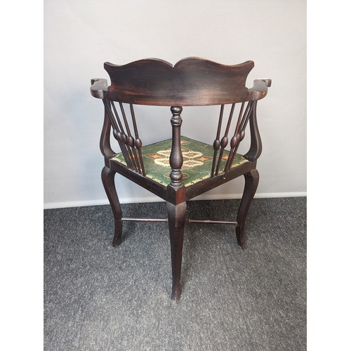 265 - Antique mahogany corner chair, the shaped and cushioned back support above open scroll arms and supp... 