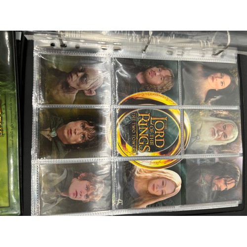 390 - 6 albums containing The Lord Of The Rings topps collectors cards and various others. Includes comple... 