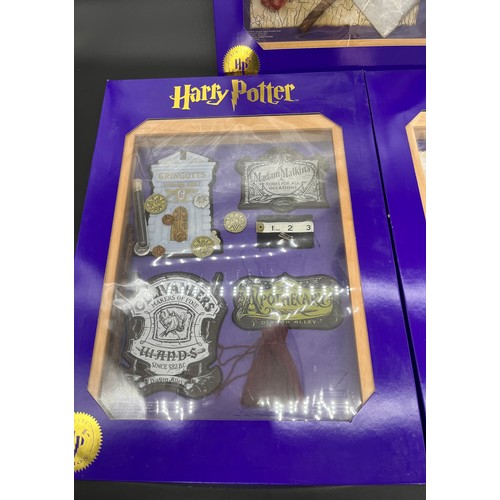 382 - Three 'The Magic Cauldron Company' Limited Edition wall hanging Harry Potter display cabinets contai... 