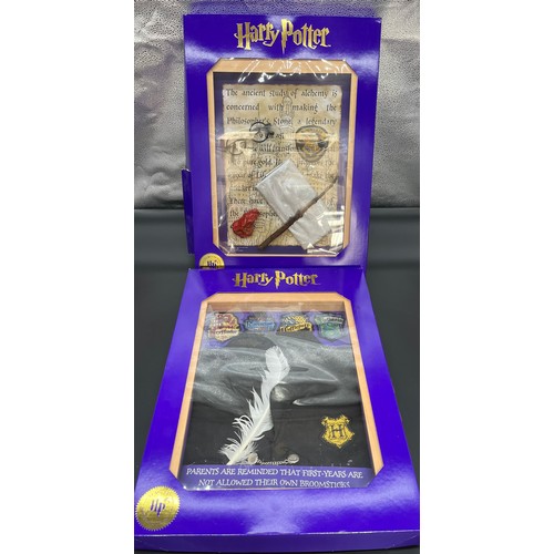 381 - Two 'The Magic Cauldron Company' Limited Edition wall hanging Harry Potter display cabinets containi... 