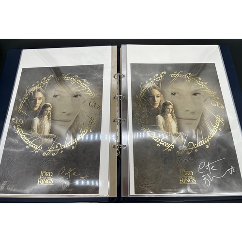 380 - An album containing various signed Lord of the rings posters and limited edition posters, some with ... 