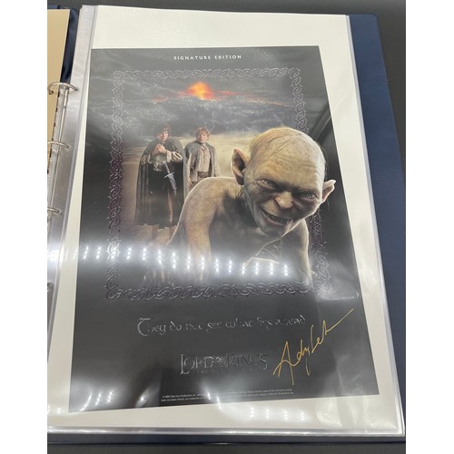 380 - An album containing various signed Lord of the rings posters and limited edition posters, some with ... 