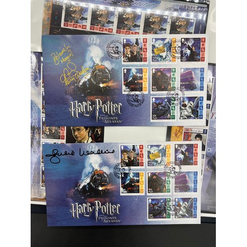 379 - Large album containing signed First day covers and stamps. Signed by John Hurt- Garrick Ollivander, ... 