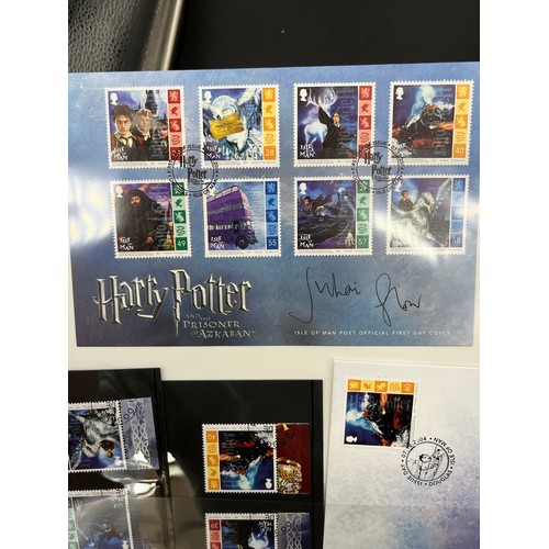 379 - Large album containing signed First day covers and stamps. Signed by John Hurt- Garrick Ollivander, ... 